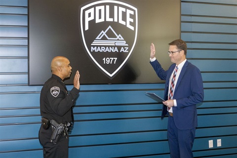 Jeffrey Pridgett takes the oath of office during historic swearing-in ceremony