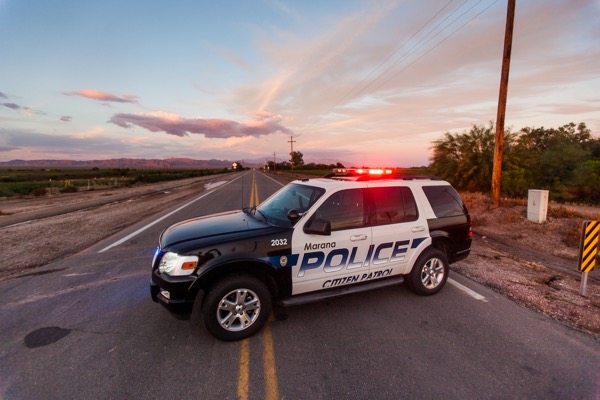 Police cruiser at sunset