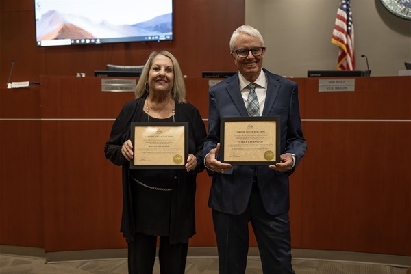 Councilmembers Ziegler and Cavanaugh hold their swearing in certificates