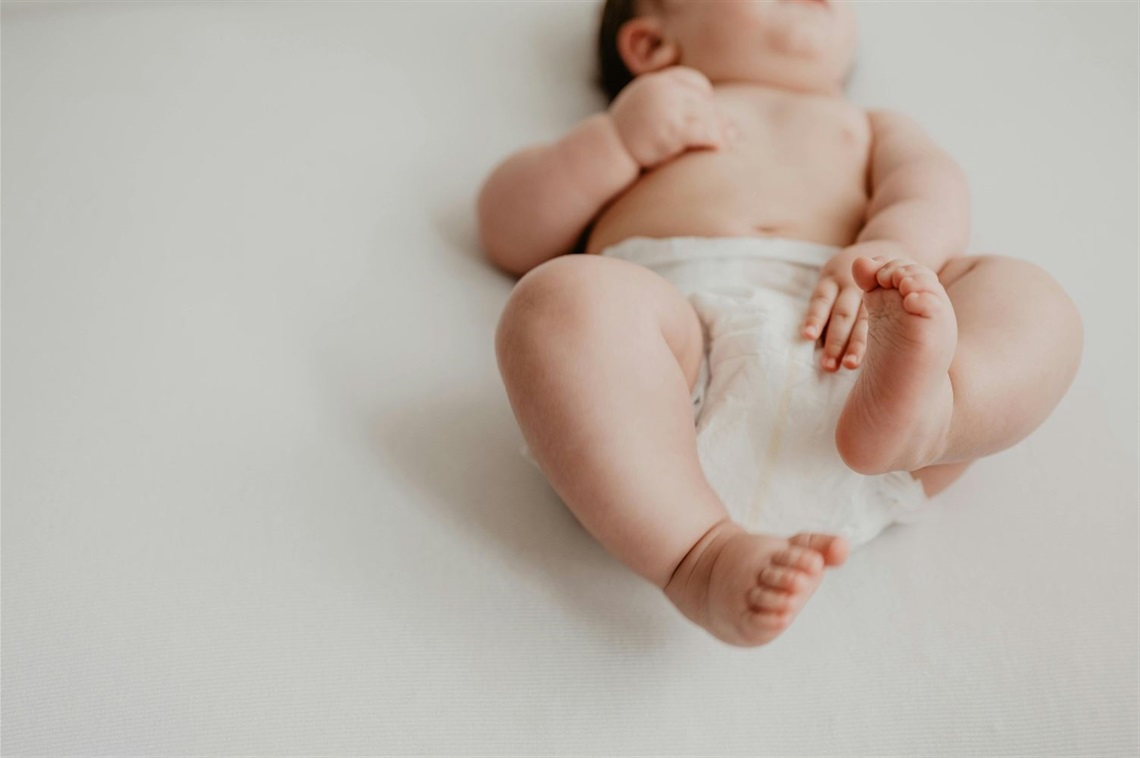 newborn baby wearing a diaper 