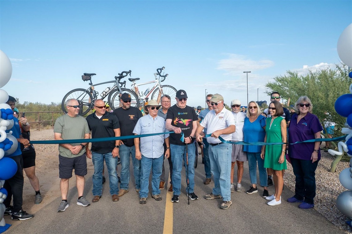 Chuck Huckelberry with Town of Marana Mayor, Council, Town Manager & project partners cutting the ribbon on a new section of the Chuck Huckelberry Loop