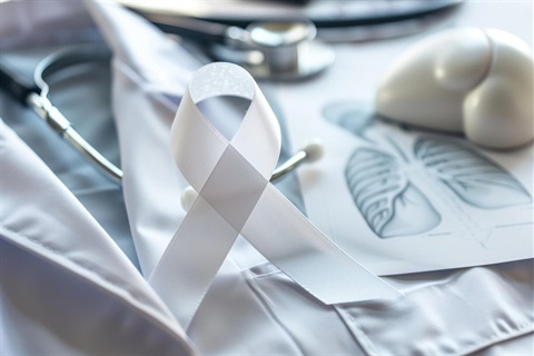 Lung Cancer Awareness Month white ribbon and doctor's coat