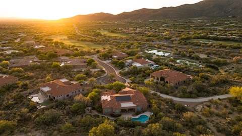 houses in Marana with a sunset